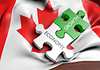 Canadian flag with economy and growth shown as puzzle pieces 