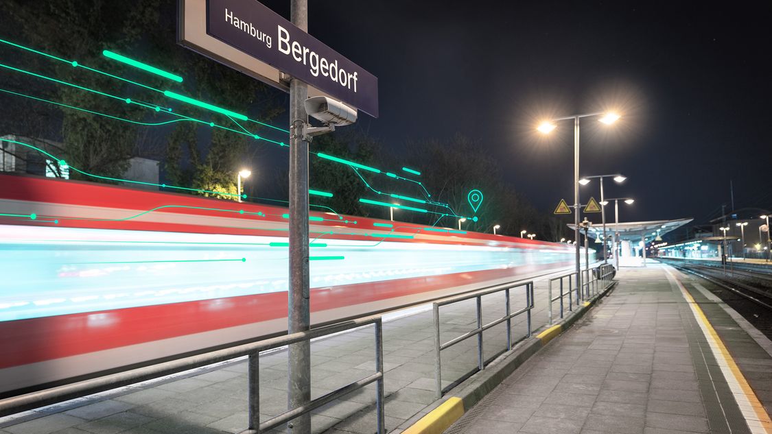 An image of a connected and automated train passing through a train station in Germany at night
