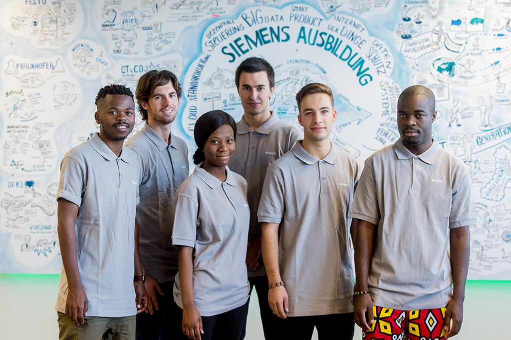 The picture shows apprentices at Siemens.