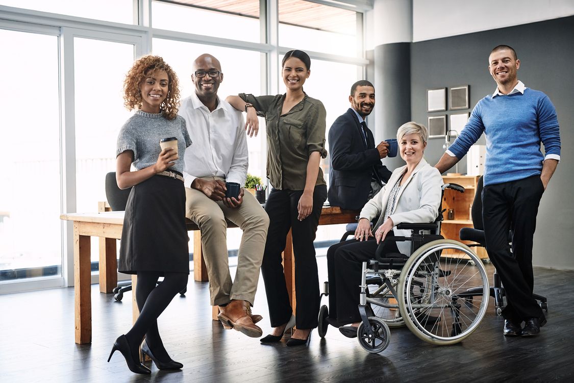 Several diverse colleagues gathered for a group picture