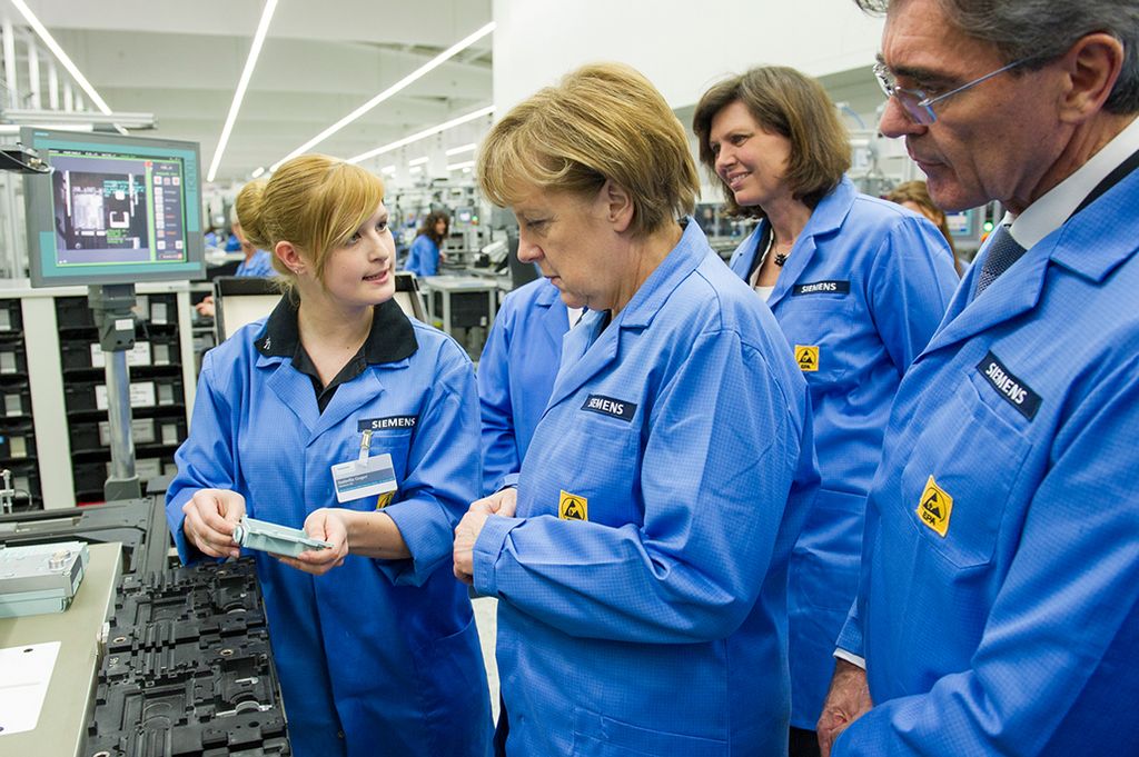 German Chancellor Merkel Visits Siemens Showcase Digital Factory