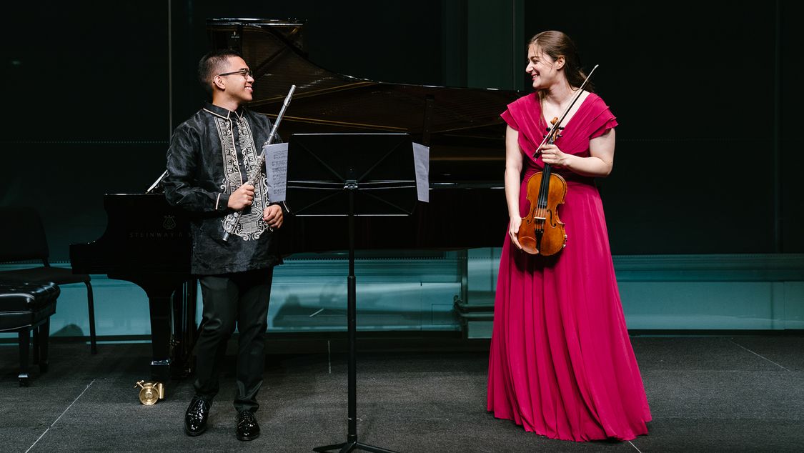 Violinist Veriko Tchumburidze and flutist Rafael Adobas Bayog on stage at Carnegie Hall