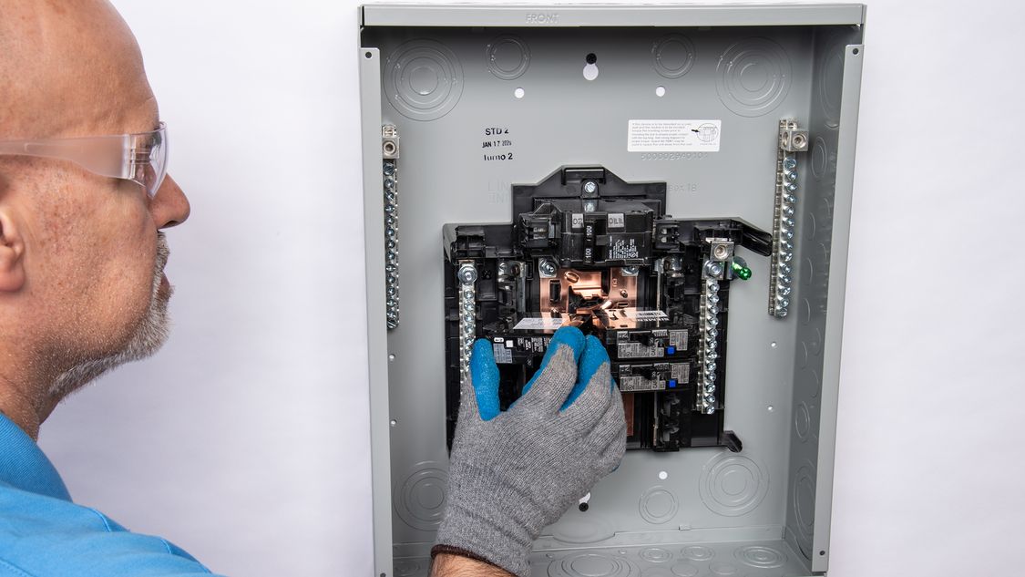 Siemens technician adjusting a Siemens control panel