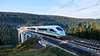 Picture of a Velaro from Siemens Mobility as an ICE of Deutsche Bahn driving over a bridge