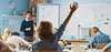 Student raising hand in classroom during lesson siemens-smart-school-teaching-learning-excellence