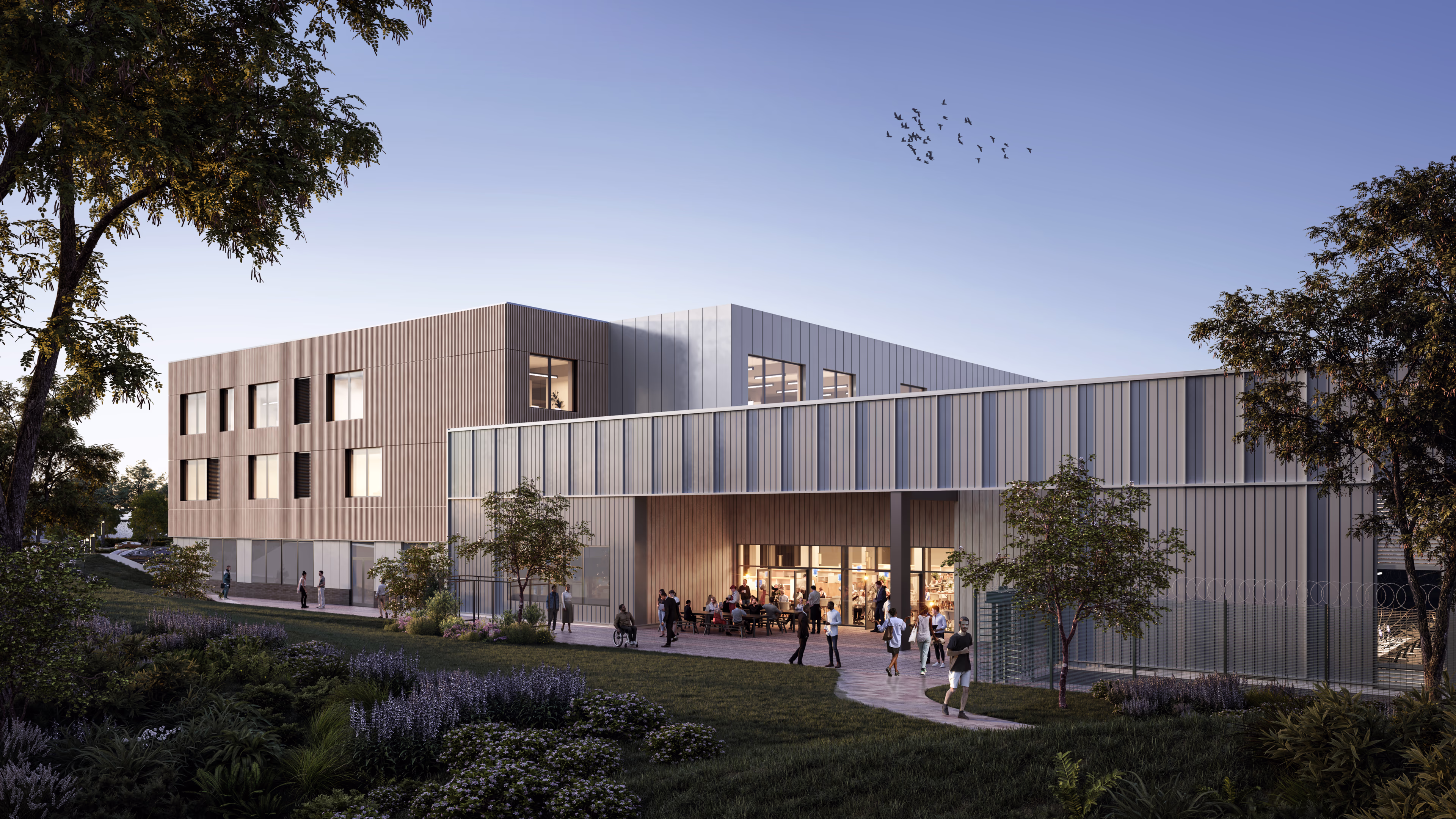 Architectural rendering of a modern two-story building with people gathered outside at dusk. Chippenham-2