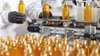 Digital transformation of consumer packaged goods illustrated by a virtual soap bottle turning into a real product, symbolizing smart manufacturing and product lifecycle management. Digital transformation of consumer packaged goods illustrated by a virtual soap bottle turning into a real product, symbolizing smart manufacturing and product lifecycle management.