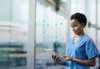 Smart healthcare at DMEA 2025: A nurse using a digital tablet, symbolizing how smart technologies drive efficiency, improve sustainability, and enhance patient care at Europe's leading digital health event. digital-healthcare-dmea-2025-smart-technologies-efficiency-sustainability-patient-care