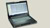 notebook preto escurto aberto com tela mostrando interface do software logo da siemens