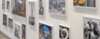 Gallery wall with diverse framed photographs and artworks