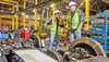 Woman and Man inspecting a bogie 