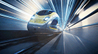 Bild des Velaro Eurostar e320 von Siemens Mobility in Diagonalansicht bei der Fahrt in einem stilisierten, futuristischen Tunnel.