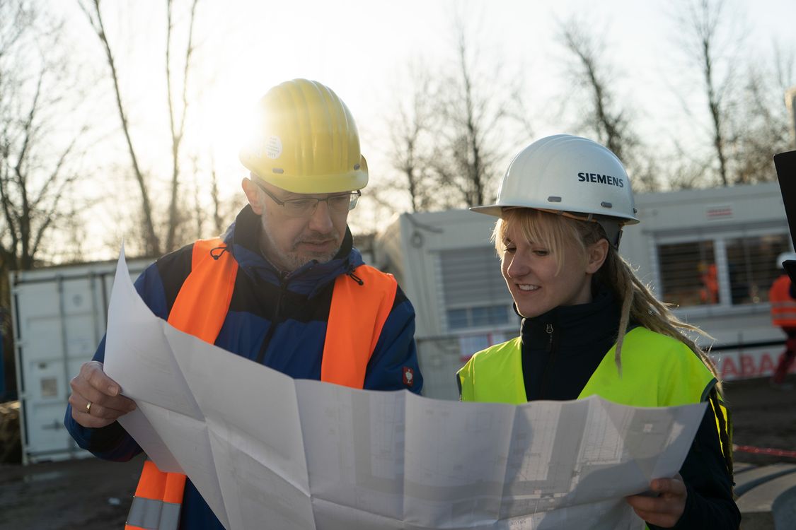 Male and female engineers consulting on a project